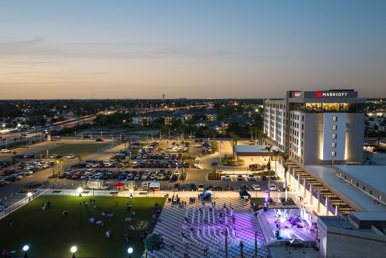 Aerial view of the Palmetto Marriott Resort & Spa and The Yard event lawn at dusk